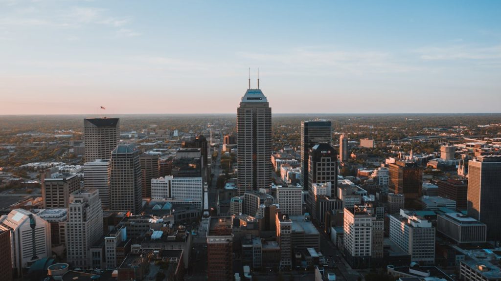 aerial-view-of-city-buildings-4372134 A breathtaking aerial view of the Indianapolis skyline at dusk, showcasing urban architecture.